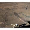 This stacked pair of color panoramas shows a trench dug by the rover