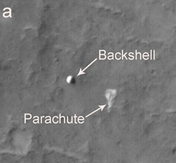 The bright irregularly shaped feature of this image is Spirit's parachute, now lying on the Martian surface