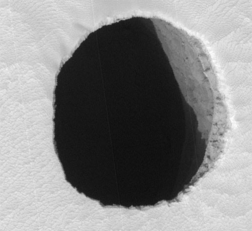 this image shows dark pit seen on Mars