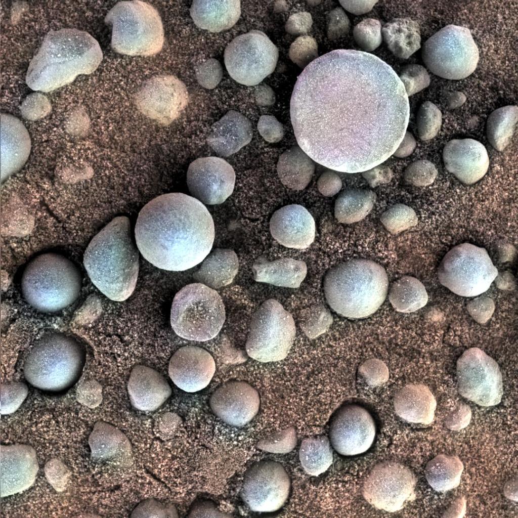 As pequenas esférulas na superfície marciana nesta imagem close-up estão perto de Fram Crater, visitou pela NASA Mars Exploration Rover Opportunity durante Abril de 2004.
