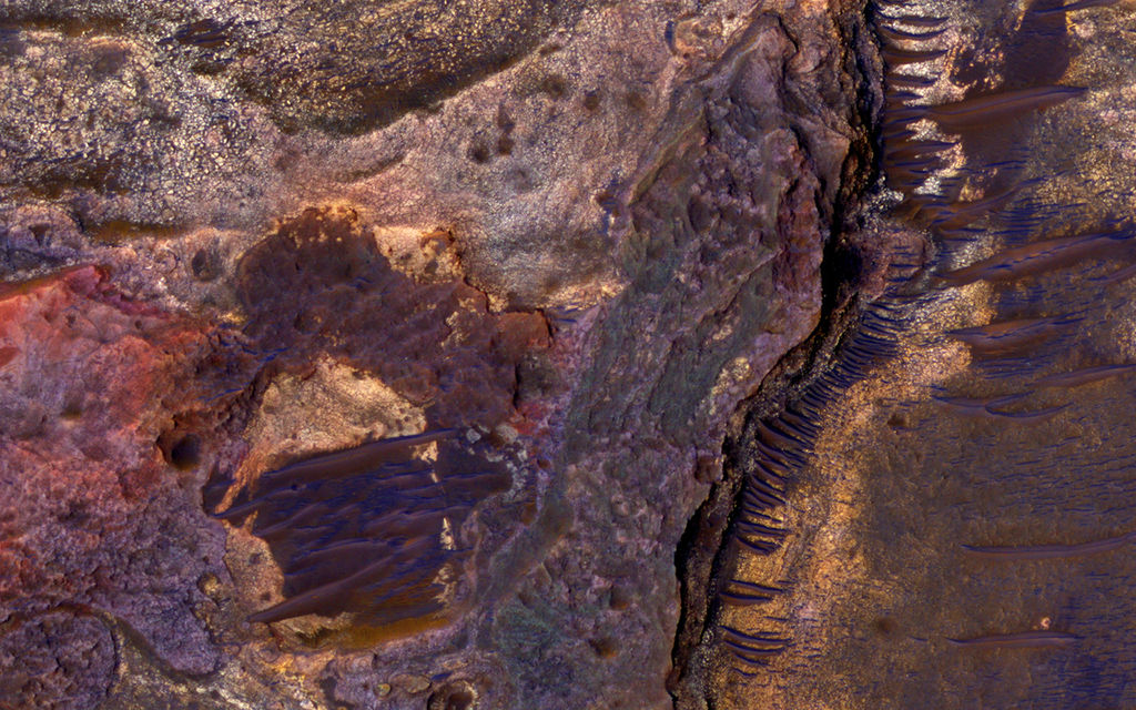 This image covers layered sedimentary rocks on the floor of an impact crater north of Eberswalde Crater.