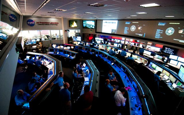 As the Curiosity rover hurdles toward Mars on the last leg of its journey, the Mars Science Laboratory Mission Operations Team assemble in Mission Control at the Space Flight Operations Facility at NASA's Jet Propulsion Laboratory in Pasadena, Calif.