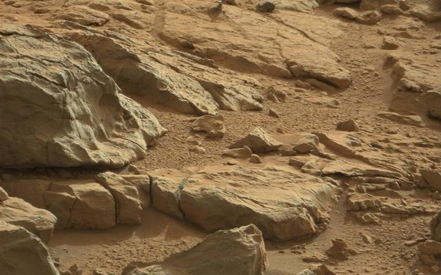 A shiny-looking Martian rock is visible in this image taken by NASA's Mars rover Curiosity's Mast Camera (Mastcam) during the mission's 173rd Martian day, or sol (Jan. 30, 2013).