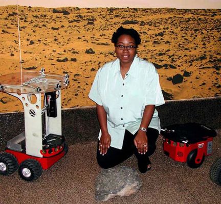 Dr. Ayanna Howard with the Safe Navigation Rover, designed to assess the terrain using human-based logic and choose safe paths accordinlgy.
