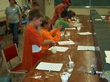 Middle school students during a Physics of Flight Camp at the University of Arizona with the GRS team, doing an experiment about the solubility of water.