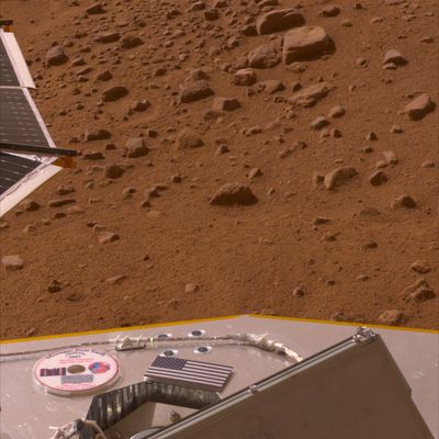 This color image shows a miniature U.S. flag on the deck of the Phoenix Mars Lander shortly after its arrival near the Martian north pole.