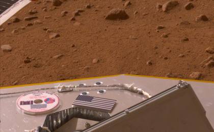 This color image shows a miniature U.S. flag on the deck of the Phoenix Mars Lander shortly after its arrival near the Martian north pole.