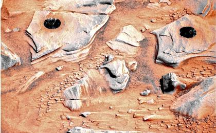 NASA's Mars Exploration Rover Spirit acquired this false-color image on Mars during the rover's 746th Martian day, or sol, after using the rock abrasion tool to brush the surfaces of rock targets informally named "Stars" (left) and "Crawfords" (right).