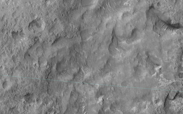 Curiosity-msl-landing-ellipse-edge-HiRise-This image shows Curiosity's landing area, rover tracks and a light blue line crosses showing the rover passing the landing-ellipse boundary.