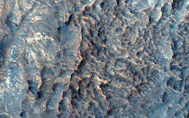 Gullied Crater Slope with Rocky Outcrops Northeast of Hellas Region