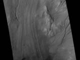 Gullies and Flow Features on Crater Wall