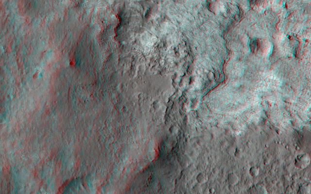 This 3D, or stereo anaglyph, view shows the upcoming science destination for NASA's Mars rover Curiosity, a region dubbed "Glenelg," where three different types of material seen from orbit come together (middle of picture).