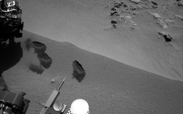 Three bite marks left in the Martian ground by the scoop on the robotic arm of NASA's Mars rover Curiosity are visible in this image taken by the rover's right Navigation Camera during the mission's 69th Martian day, or sol (Oct. 15, 2012).