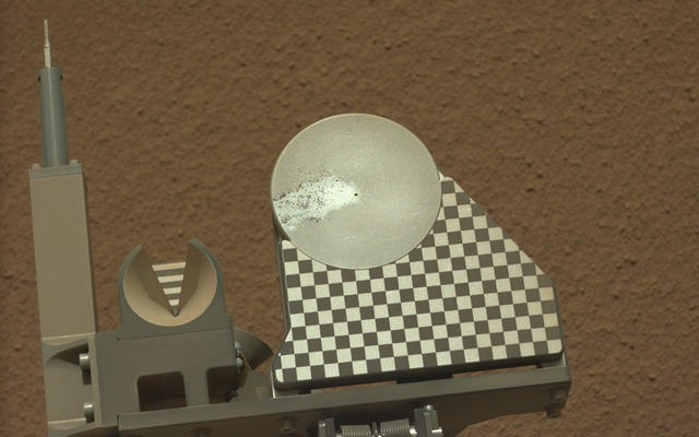 The robotic arm on NASA's Mars rover Curiosity delivered a sample of Martian soil to the rover's observation tray for the first time during the mission's 70th Martian day, or sol (Oct. 16, 2012)