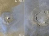 This image shows two orbital views, arranged side by side, of whirlwinds spinning on calderas at the summits of volcanoes. On the left is Arsia Mons; on the right is Olympus Mons. Above the calderas are thin veils of water-ice clouds. On the left, the clouds radiate outward in a counterclockwise, spiral pattern like the spiral storm below.