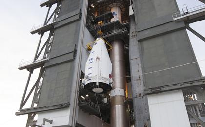 NASA's MAVEN (Mars Atmosphere and Volatile EvolutioN) spacecraft, inside a payload fairing, is hoisted to the top of a United Launch Alliance Atlas V rocket at the Vertical Integration Facility at Cape Canaveral Air Force Station's Space Launch Complex 41.