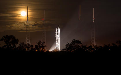 A full moon rises behind the United Launch Alliance Atlas V rocket with NASA's Mars Atmosphere and Volatile EvolutioN (MAVEN) spacecraft onboard at the Cape Canaveral Air Force Station Space Launch Complex 41, Cape Canaveral, Fla. on Nov. 17, 2013.