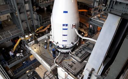Crews guide NASA's Mars Atmosphere and Volatile EvolutioN, or MAVEN, spacecraft, inside a payload fairing, into place atop a United Launch Alliance Atlas V rocket at the Vertical Integration Facility at Space Launch Complex 41.