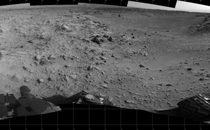 This panorama of the landscape surrounding NASA's Curiosity Mars rover on July 31, 2014, offers a view into sandy lower terrain called "Hidden Valley," which is on the planned route ahead.