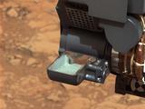 This image from NASA's Curiosity rover shows the first sample of powdered rock extracted by the rover's drill.