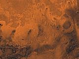 A color image of the south Chryse basin Valles Marineris outflow channels on Mars; north toward top. The scene shows on the southwest corner the chaotic terrain of the east part of Valles Marineris and two of its related canyons: Eos and Capri Chasmata (south to north). Ganges Chasma lies directly north. The chaos in the southern part of the image gives rise to several outflow channels, Shalbatana, Simud, Tiu, and Ares Valles (left to right), that drained north into the Chryse basin. The mouth of Ares Valles is the site of the Mars Pathfinder lander.

This image is a composite of Viking medium-resolution images in black and white and low-resolution images in color. The image extends from latitude 20 degrees S. to 20 degrees N. and from longitude 15 degrees to 53 degrees; Mercator projection.

The south Chryse outflow channels are cut an average of 1 km into the cratered highland terrain. This terrain is about 9 km above datum near Valles Marineris and steadily decreases in elevation to 1 km below datum in the Chryse basin. Shalbatana is relatively narrow (10 km wide) but can reach 3 km in depth. The channel begins at a 2- to 3-km-deep circular depression within a large impact crater, whose floor is partly covered by a chaotic material, and ends in Simud Valles. Tiu and Simud Valles consist of a complex of connected channel floors and chaotic terrain and extend as far south as and connect to eastern Valles Marineris. Ares Vallis originates from discontinuous patches of chaotic terrain within large craters. In the Chryse basin the Ares channel forks; one branch continues northwest into central Chryse Planitia (Latin for plain) and the other extends north into eastern Chryse Planitia.
