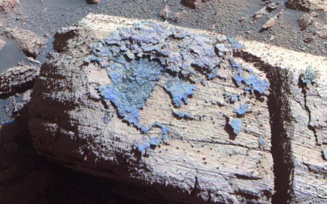 This image from the panoramic camera on NASA's Mars Exploration Rover Opportunity shows a rock called "Chocolate Hills," which the rover found and examined at the edge of a young crater called "Concepción."