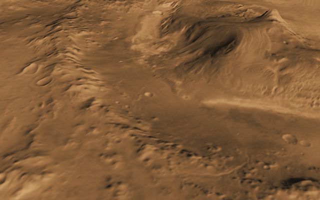 This computer-generated view based on multiple orbital observations shows Mars' Gale crater as if seen from an aircraft northwest of the crater.