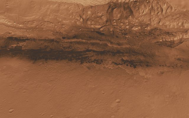 This oblique view of the lower mound in Gale crater on Mars shows an area of top scientific interest for the Mars Science Laboratory mission.