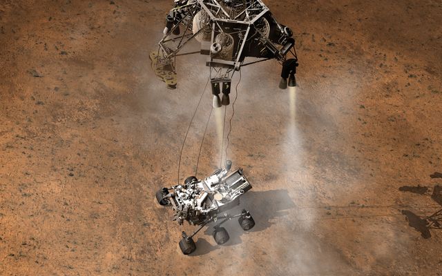 This artist's concept depicts the moment immediately after NASA's Curiosity rover touches down onto the Martian surface.