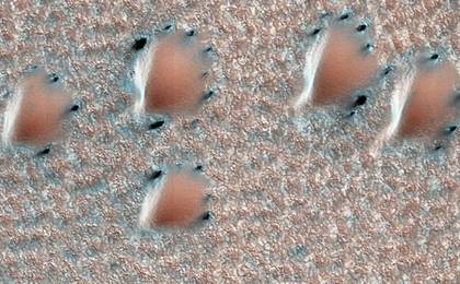 This scene is from early spring in the northern hemisphere of Mars. These dunes are covered with a layer of seasonal carbon dioxide ice (dry ice).