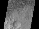 A large sandsheet with surface dune forms is shown in today's image of Aonia Terra.
