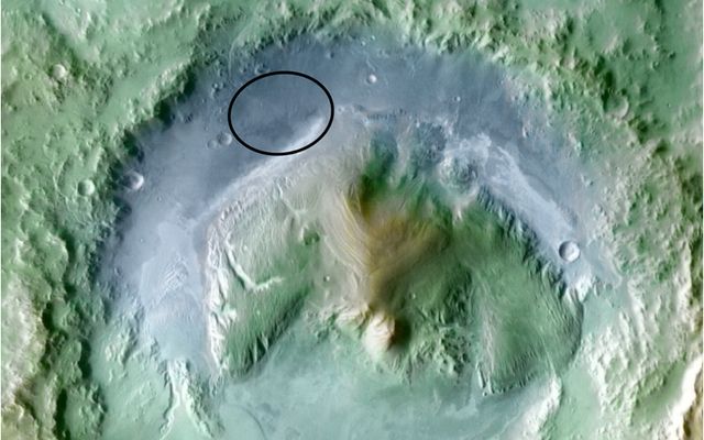 Color coding in this image of Gale Crater on Mars represents differences in elevation, with blue relatively low and tan relatively high.