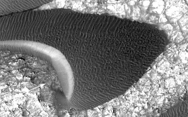 Back-and-forth blinking of this two-image animation shows movement of a sand dune on Mars. The images are part of a study published by Nature on May 9, 2012, reporting movement of Martian sand dunes at about the same flux (volume per time) as movement of dunes in Antarctica on Earth.