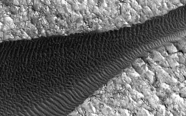 Back-and-forth blinking of this two-image animation shows movement of ripples covering a sand dune on Mars.