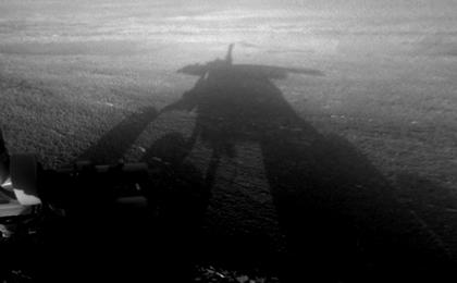 NASA's Mars Exploration Rover Opportunity captured this view of its afternoon shadow stretching into Endeavour Crater during the 3,051st Martian day, or sol, of Opportunity's work on Mars (Aug. 23, 2012).