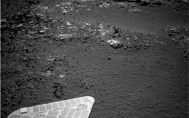 The team operating NASA's Mars Exploration Rover Opportunity plans to investigate rocks in this area photographed by the rover's navigation camera during the 3,057th Martian day, or sol, of Opportunity's work on Mars (Aug. 23, 2012).
