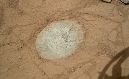 This image from the Mars Hand Lens Imager (MAHLI) on NASA's Mars rover Curiosity shows the patch of rock cleaned by the first use of the rover's Dust Removal Tool (DRT).