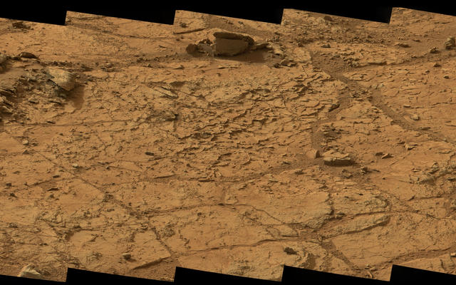 This wide view of the 'John Klein' location selected for the first rock drilling by NASA's Mars rover Curiosity is a mosaic taken by Curiosity's right Mast Camera (Mastcam) during the afternoon of the 153rd Martian day, or sol, of the rover's work on Mars.