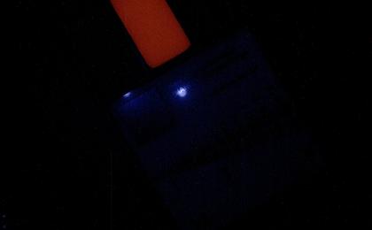 This image of a calibration target illuminated by ultraviolet LEDs (light emitting diodes) is part of the first set of nighttime images taken by the Mars Hand Lens Imager (MAHLI) camera at the end of the robotic arm of NASA's Mars rover Curiosity.