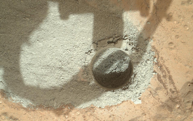 In an activity called the "mini drill test," NASA's Mars rover Curiosity used its drill to generate this ring of powdered rock for inspection in advance of the rover's first full drilling.