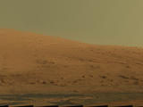 This mosaic of images from the Mast Camera (Mastcam) on NASA's Mars rover Curiosity shows Mount Sharp in raw color as recorded by the camera.