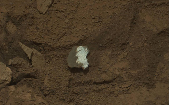 This raw image of "Tintina," a broken rock fragment in a rover wheel track, was taken by Curiosity's Mast Camera (Mastcam).