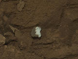 This raw image of "Tintina," a broken rock fragment in a rover wheel track, was taken by Curiosity's Mast Camera (Mastcam).