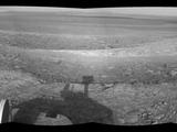This right-eye member of a stereo pair of images from the navigation camera on NASA's Mars Exploration Rover Opportunity shows a vista across Endeavour Crater, with the rover's own shadow in the foreground.