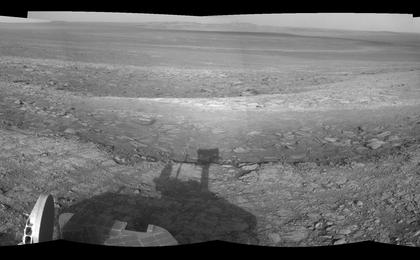 This right-eye member of a stereo pair of images from the navigation camera on NASA's Mars Exploration Rover Opportunity shows a vista across Endeavour Crater, with the rover's own shadow in the foreground.