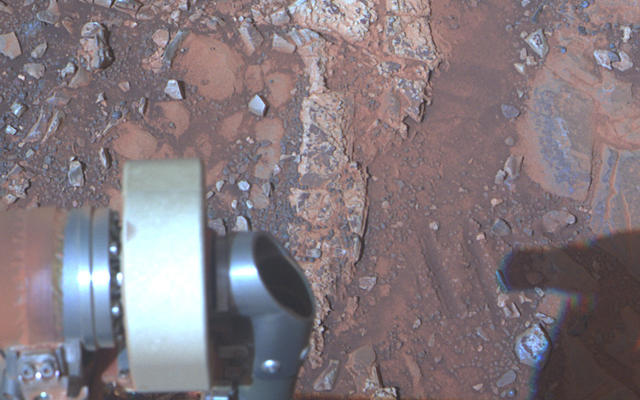 The pale rock in the upper center of this image, about the size of a human forearm, includes a target called "Esperance," which was inspected by NASA's Mars Exploration Rover Opportunity.