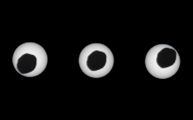 This set of three images shows views three seconds apart as the larger of Mars' two moons, Phobos, passed directly in front of the sun as seen by NASA's Mars rover Curiosity.