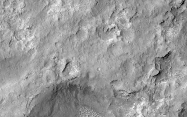 NASA's Curiosity Mars rover and tracks left by its driving appear in this portion of a Dec. 11, 2013, observation by the High Resolution Imaging Science Experiment (HiRISE) camera on NASA's Mars Reconnaissance Orbiter.