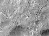 NASA's Curiosity Mars rover and tracks left by its driving appear in this portion of a Dec. 11, 2013, observation by the High Resolution Imaging Science Experiment (HiRISE) camera on NASA's Mars Reconnaissance Orbiter.
