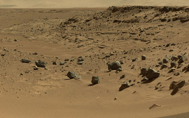 This view combines several frames taken by the Mast Camera (Mastcam) on NASA's Mars rover Curiosity, looking into a valley to the west from the eastern side of a dune at the eastern end of the valley.